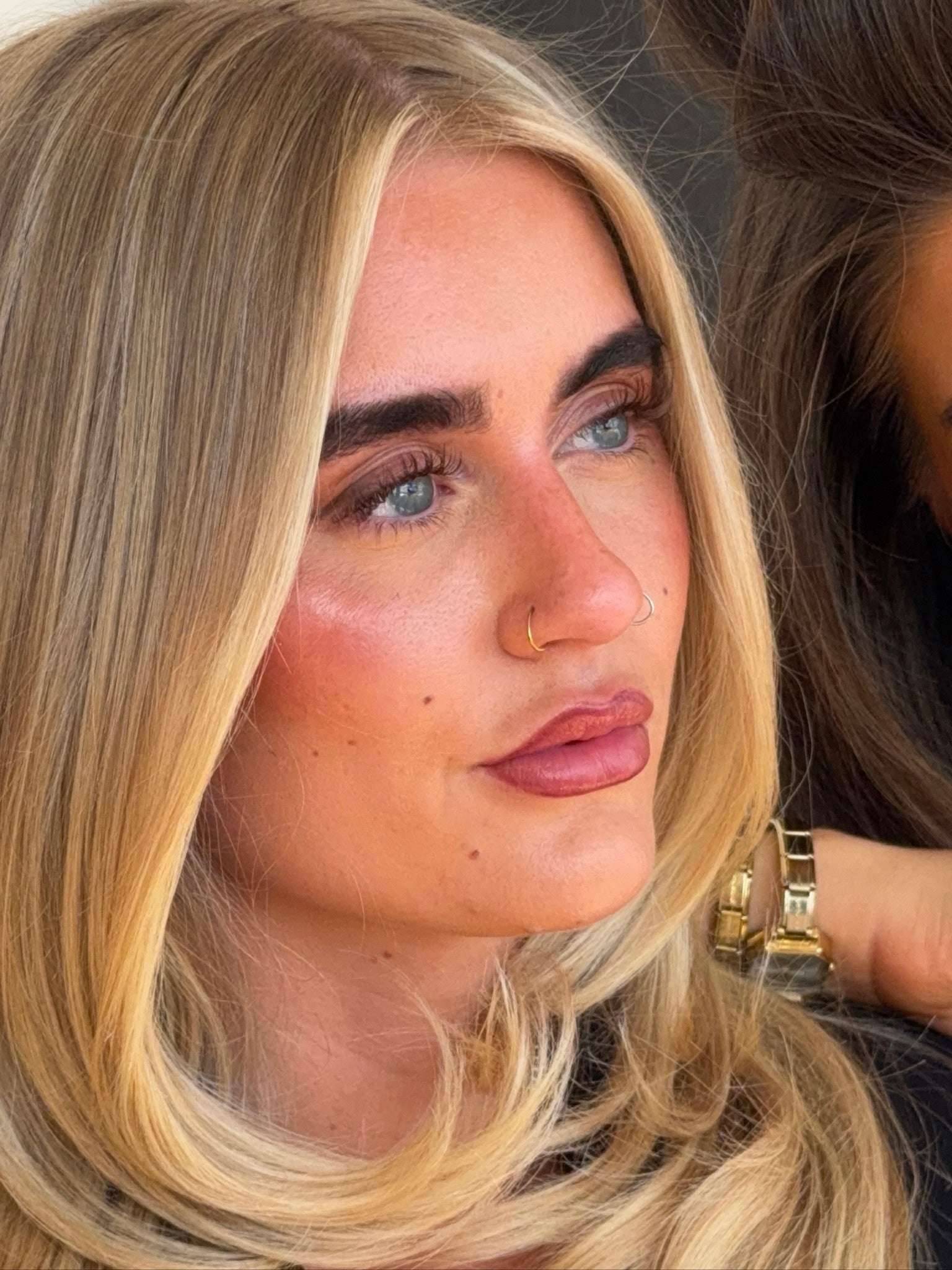 Blonde girl, with blue eyes and lashes extensions