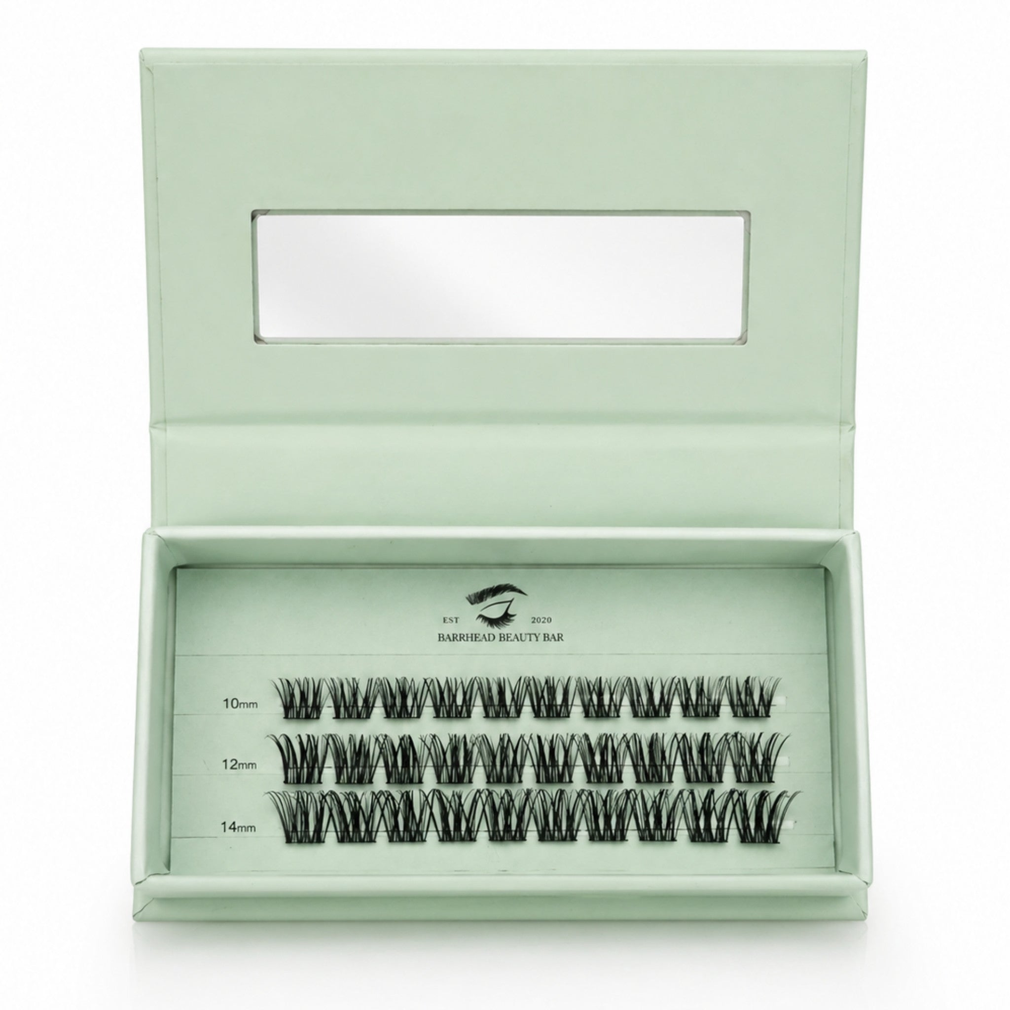 Set of false eyelashes in a green box with a clear lid on a white background